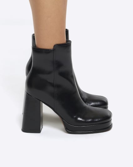Black platform heeled ankle boots