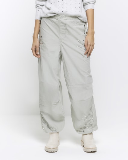 Green embellished parachute trousers