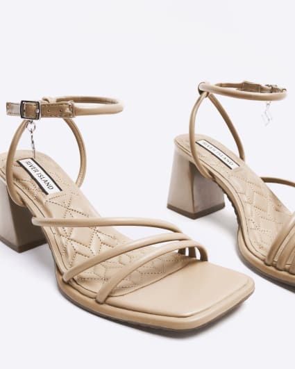 Beige strappy heeled sandals