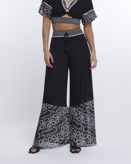 Black floral shirred wide leg trousers