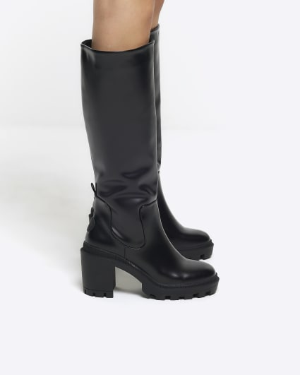 Black heeled knee high boots