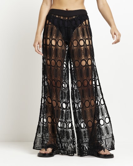 Black lace flared trousers