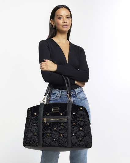 Black velvet quilted travel bag