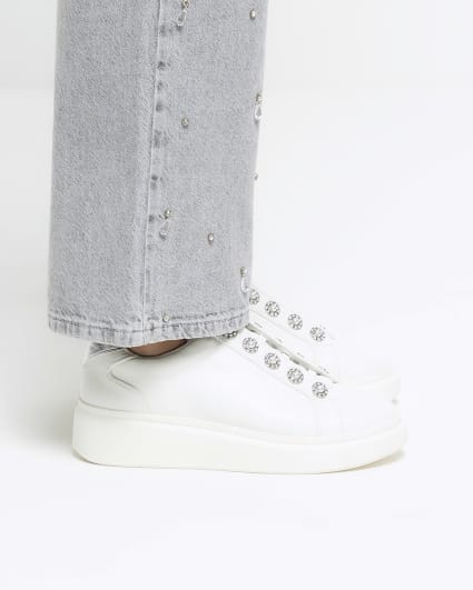 White pearl button slip on trainers