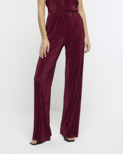 Red plisse flared trousers