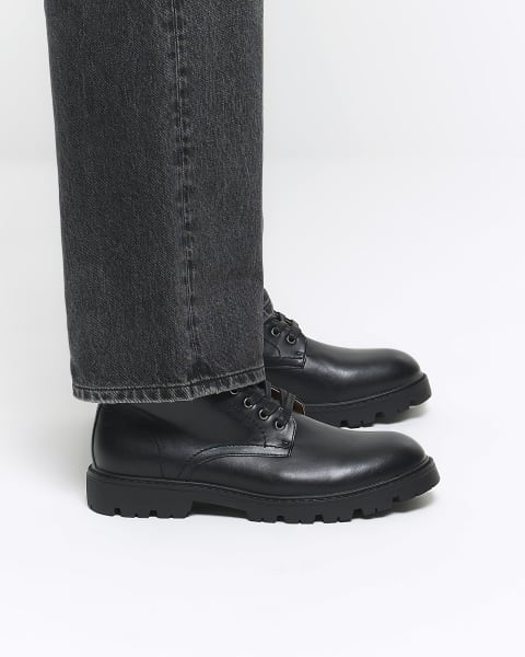 Black faux leather combat boots