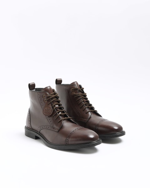 Brown leather brogue boots