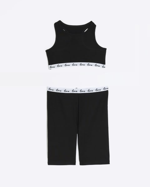 Girls black crop top and cyclist shorts set