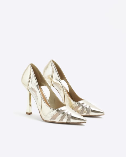 Gold cut out heeled court shoes