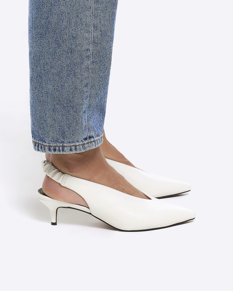 White kitten heeled court shoes