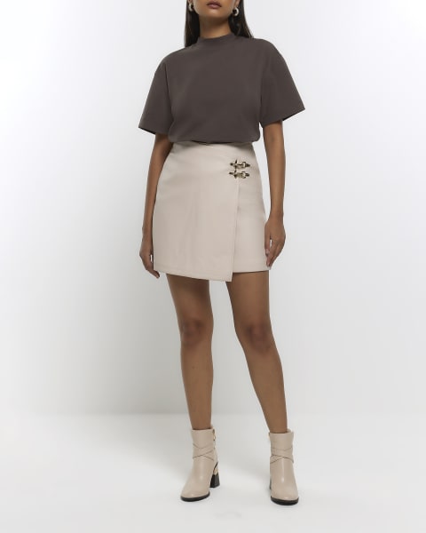 Cream faux leather buckle mini skirt