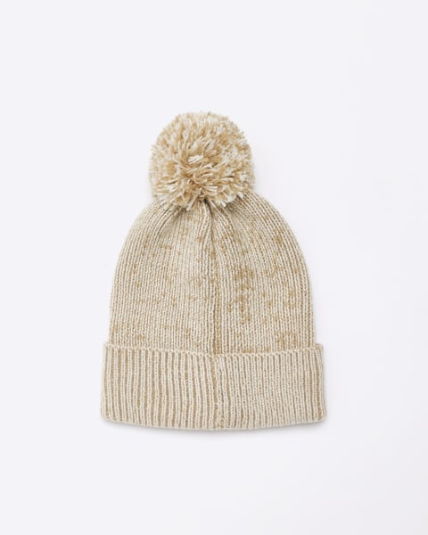 Beige knitted pom pom beanie