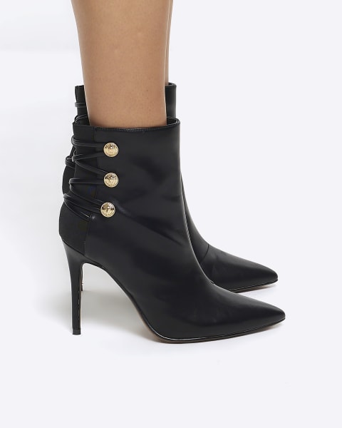 Black tied up heeled boots