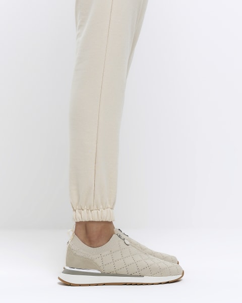 Beige knitted zip trainers