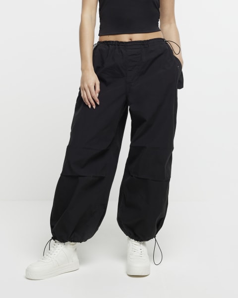 Petite black low rise parachute trousers