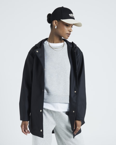 Black hooded rain mac