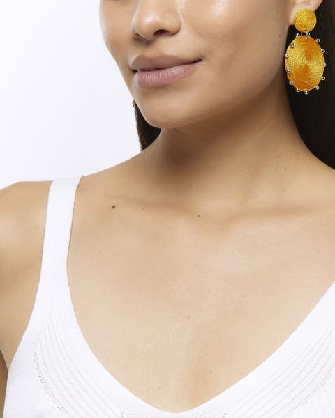 Orange woven circle drop earrings