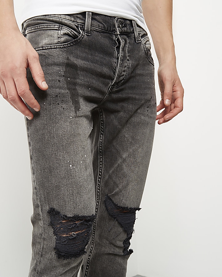 Black paint splattered Sid skinny jeans