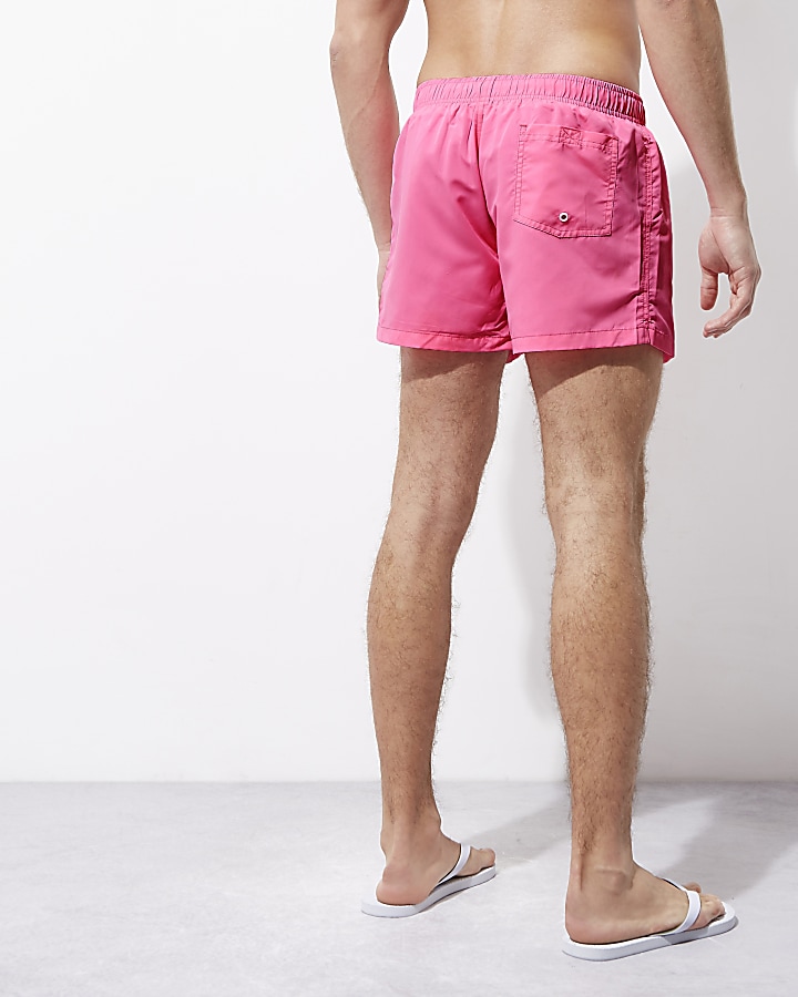 Pink neon swim shorts