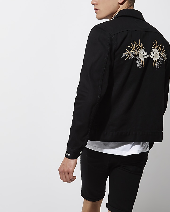 Black skull embroidered denim jacket