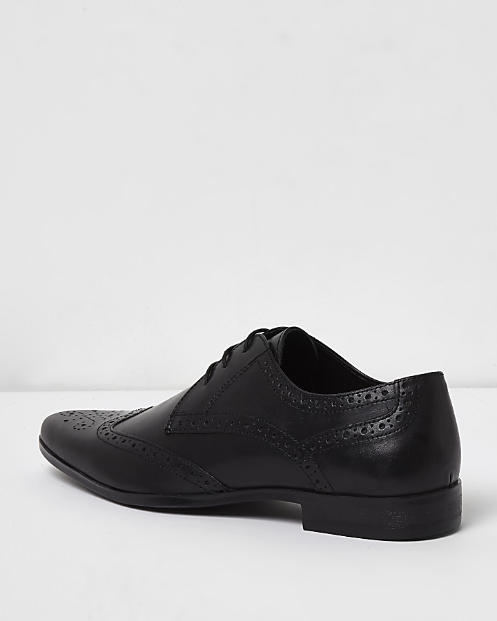 Black leather pointed brogues