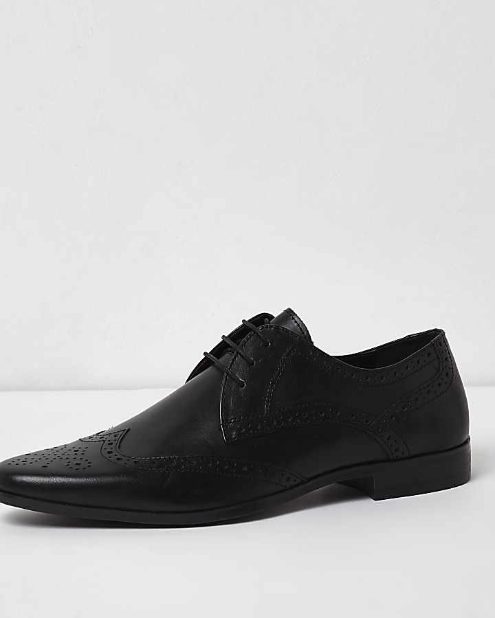 Black leather pointed brogues