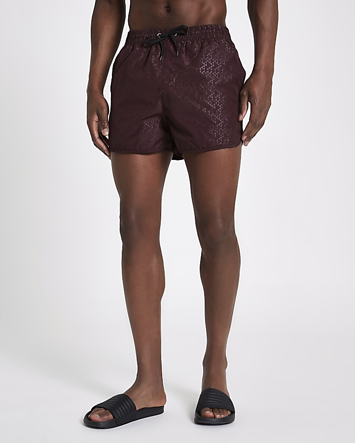 Burgundy triangle embossed runner swim shorts