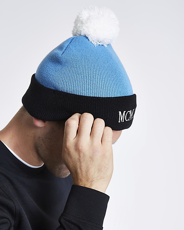 Blue embroidered bobble beanie hat