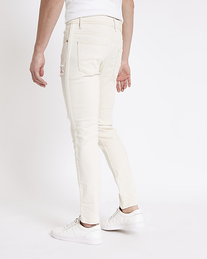 White skinny fit taped ripped jeans