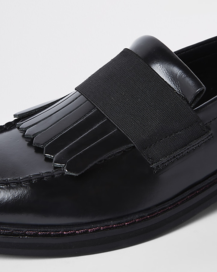 Black leather fringe loafers