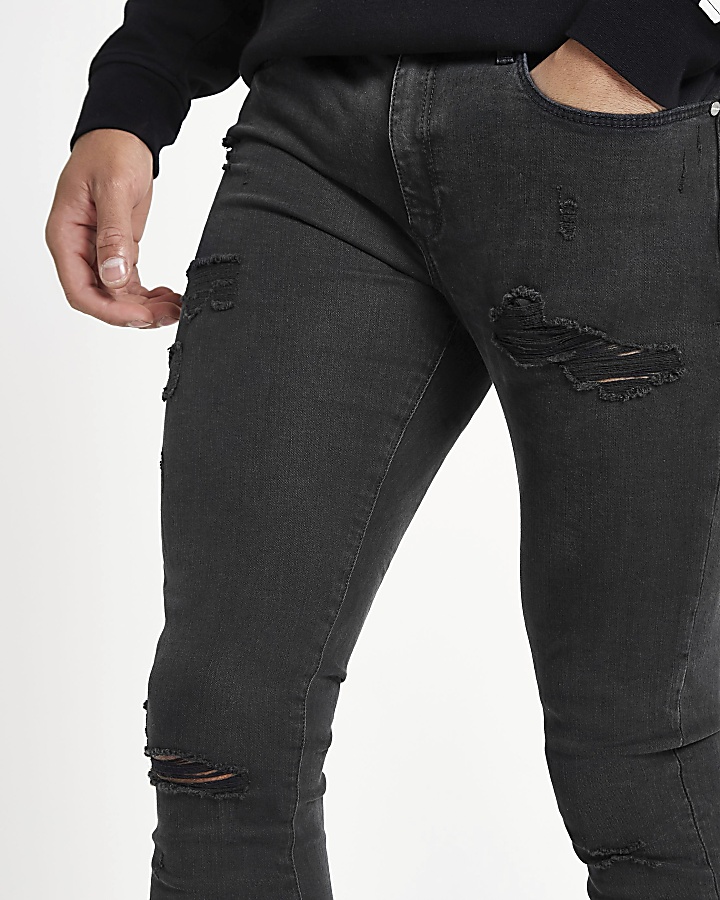 Black Ollie spray on ripped jeans