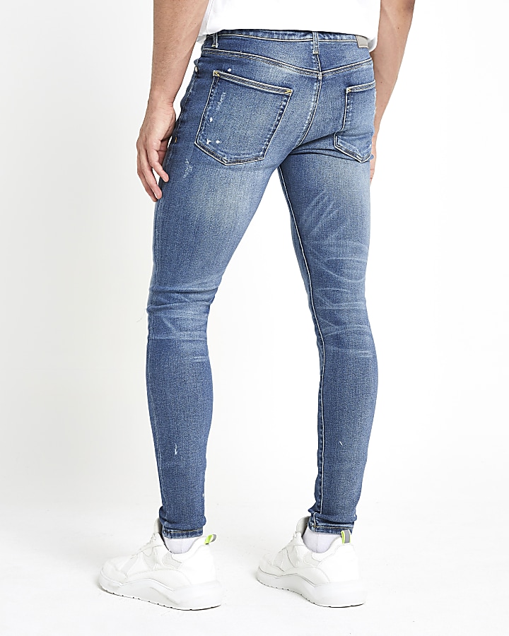 Mid blue Ollie skinny spray on ripped jeans