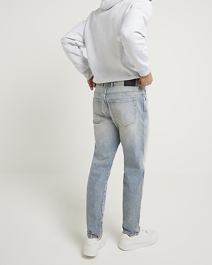Blue tapered fit faded jeans