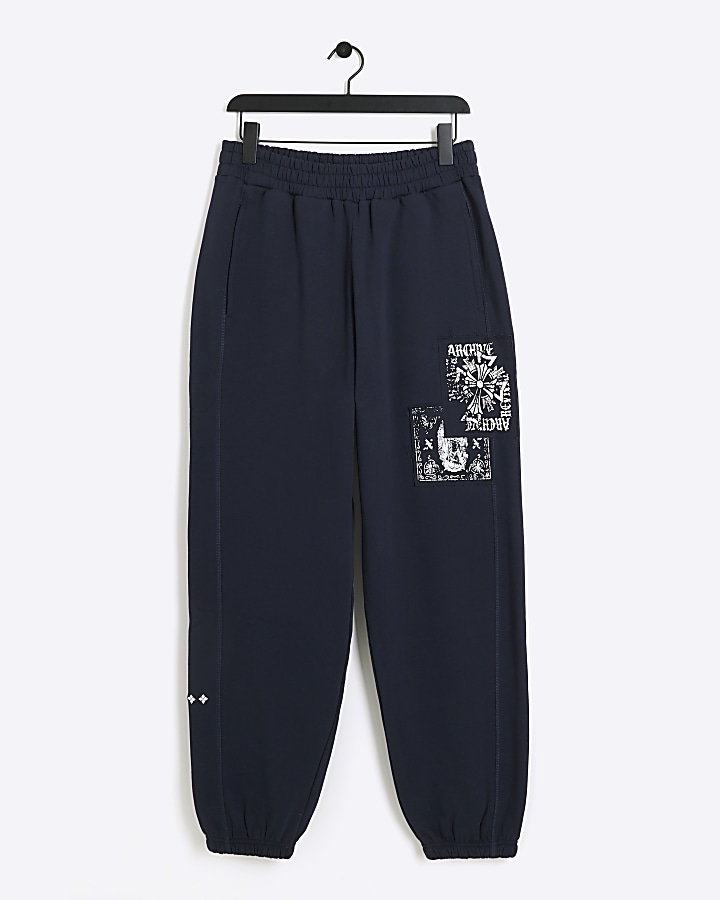 Navy regular fit gothic graphic sweatpants | River Island