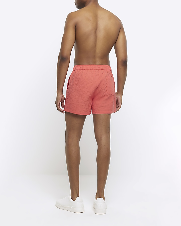 Pink regular fit seersucker swim shorts