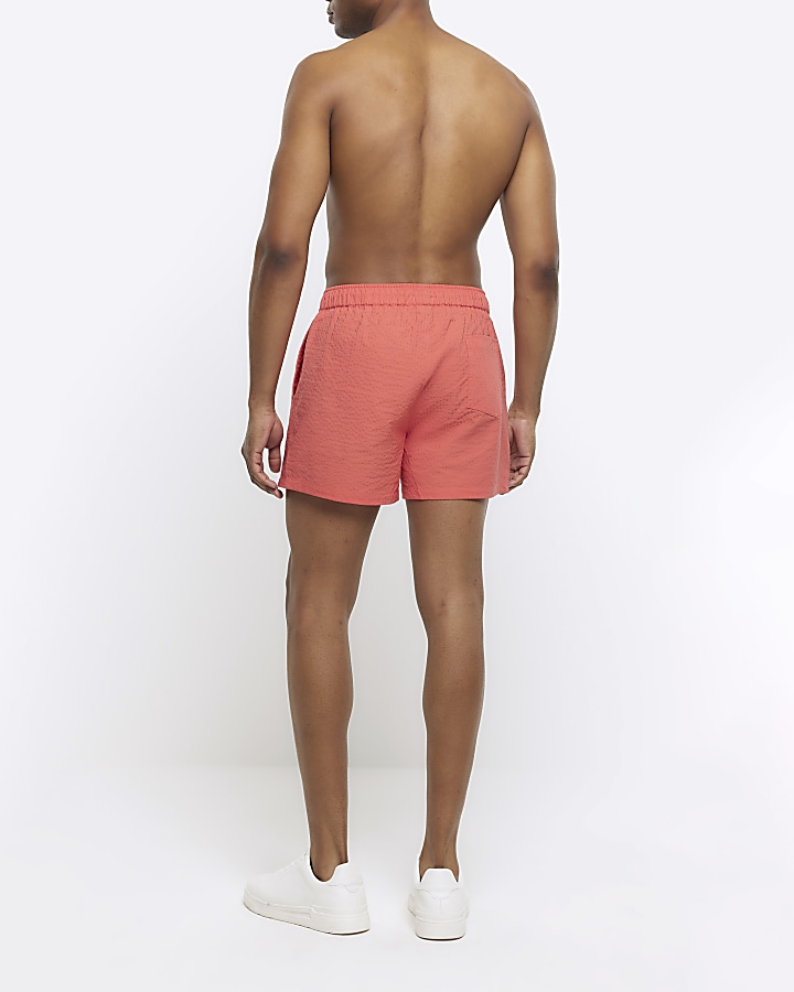 Pink regular fit seersucker swim shorts River Island