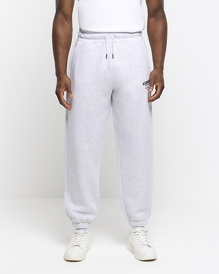 Grey regular fit graphic tracksuit joggers | River Island