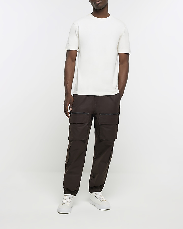Brown slim fit multi pocket cargo trousers | River Island