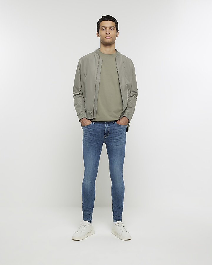 Blue super skinny spray on washed jeans | River Island