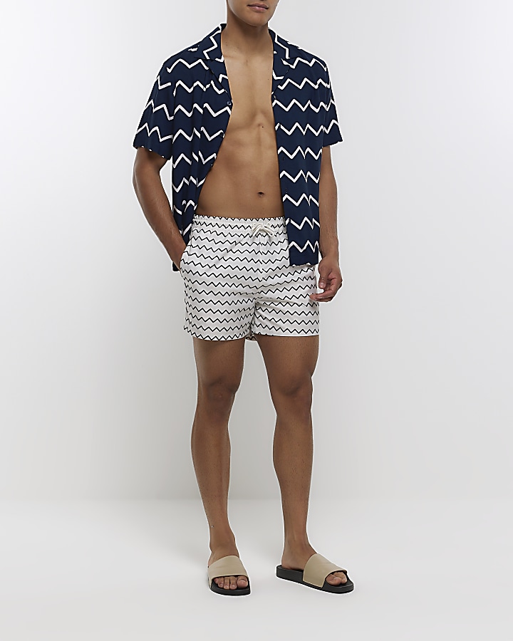 Beige regular fit zig zag swim shorts