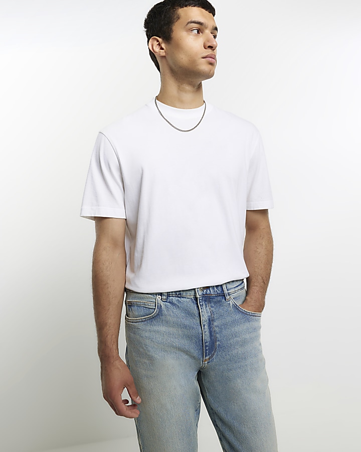 Blue tapered fit faded jeans | River Island