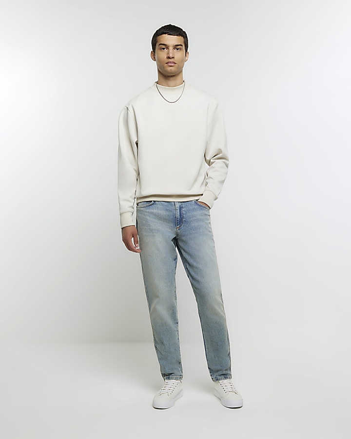 Blue tapered fit faded jeans | River Island