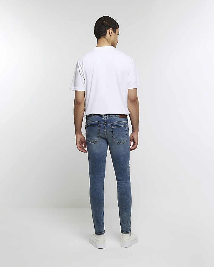 Blue spray on super skinny ripped jeans | River Island