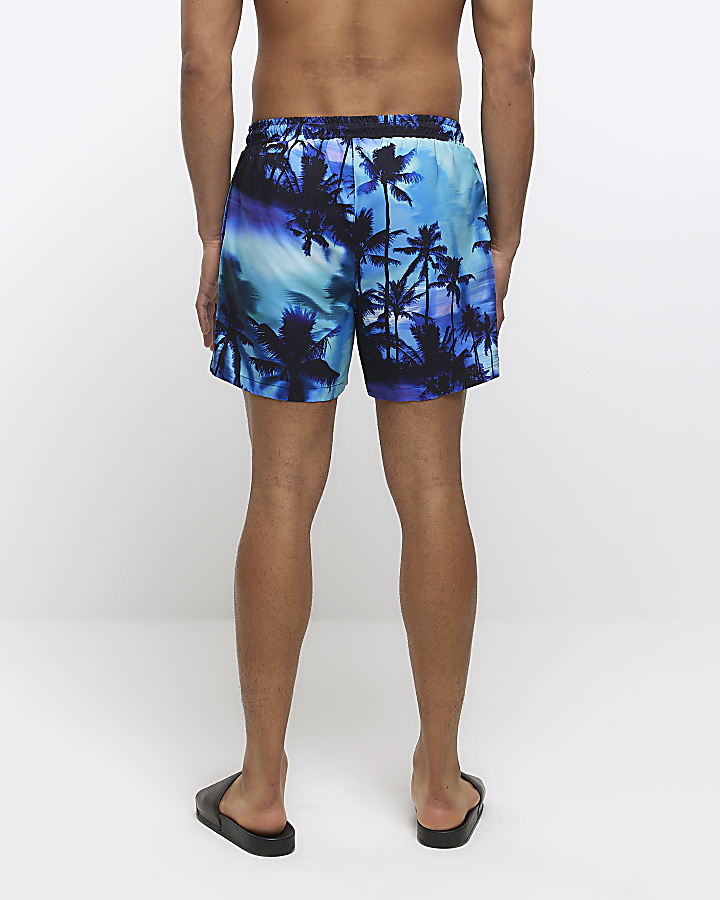 Purple regular fit graphic print swim shorts | River Island