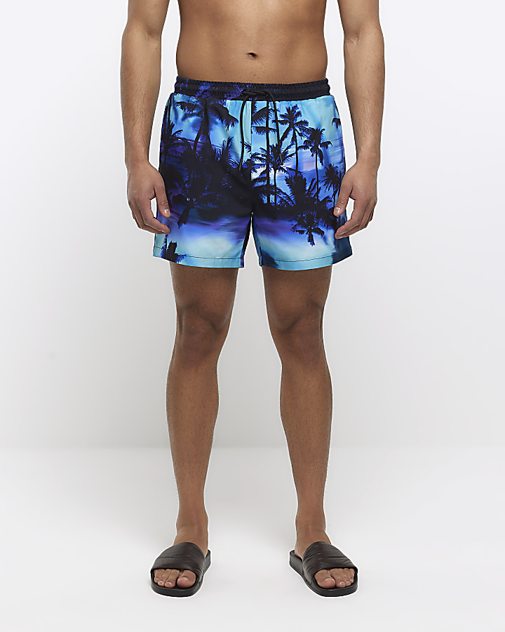 Purple regular fit graphic print swim shorts | River Island