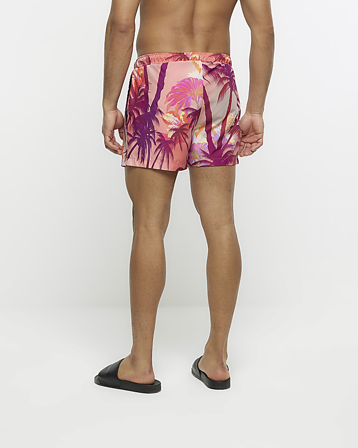 Pink regular fit palm print swim shorts | River Island
