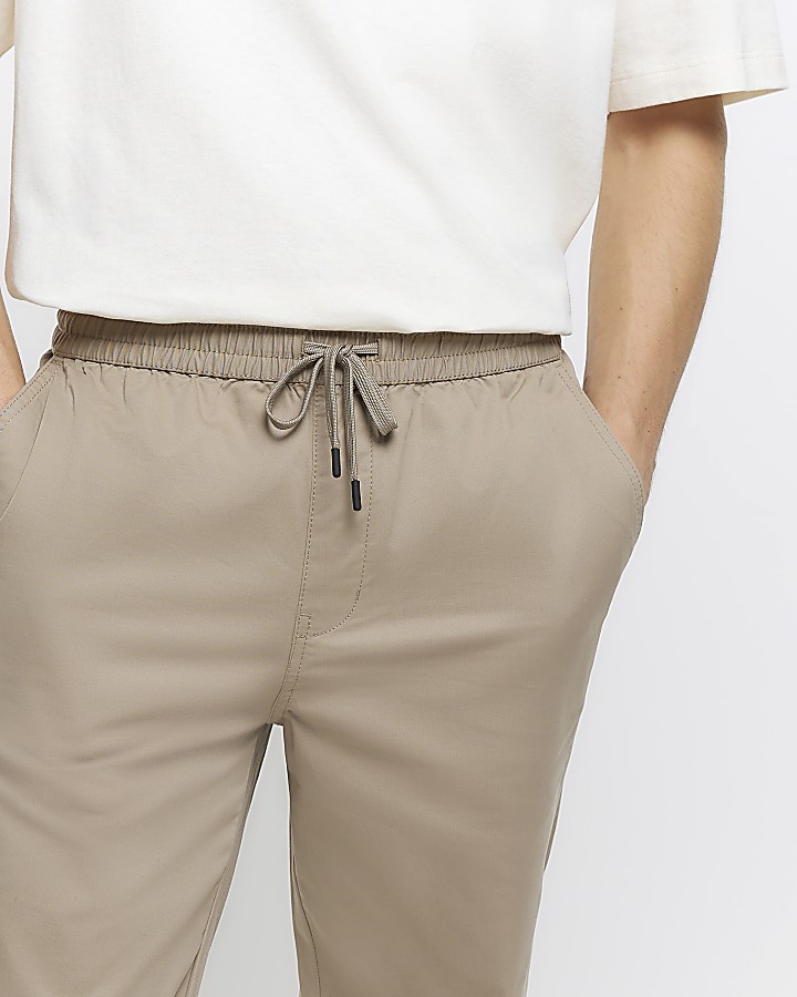 Beige regular fit pull on cuffed trousers