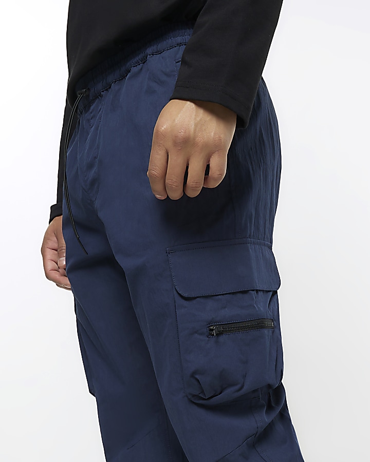 Navy regular fit cuffed cargo trousers | River Island