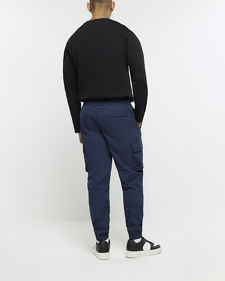 Navy regular fit cuffed cargo trousers | River Island