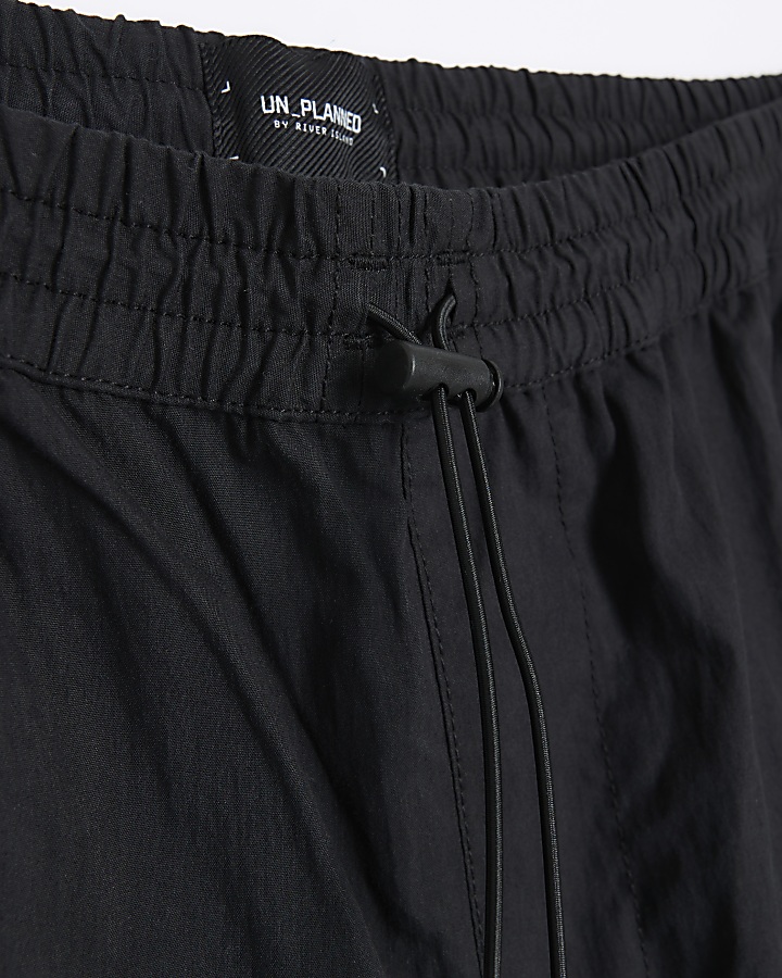 Black regular fit cuffed cargo trousers | River Island